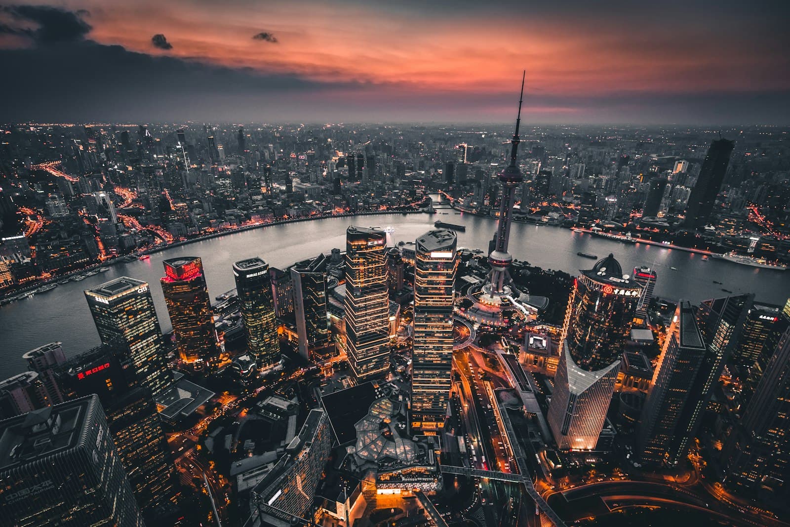 Shanghai skyline at twilight featuring Oriental Pearl Tower and Pudong financial district